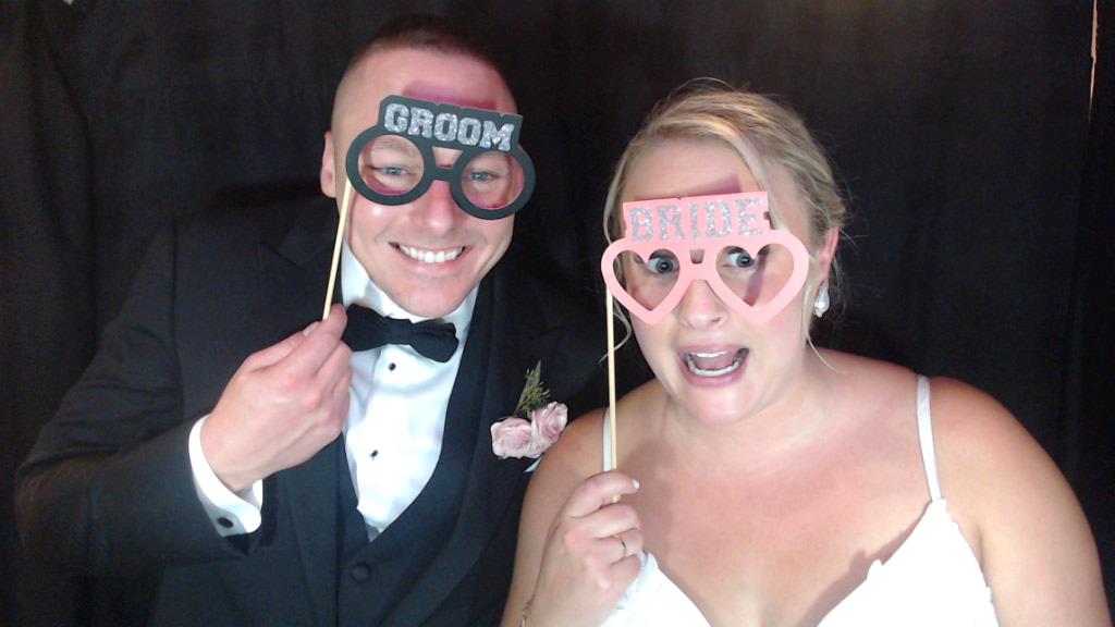 Photo booth at wedding with props.