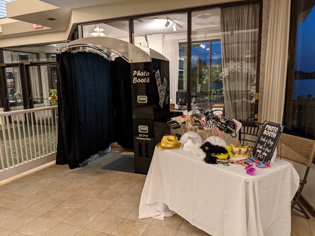 Photo Booth at wedding with multiple props on a table