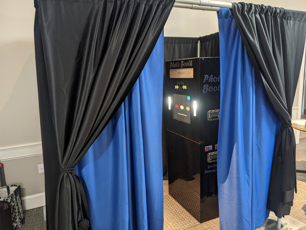 enclosed photo booth but black and blue curtains