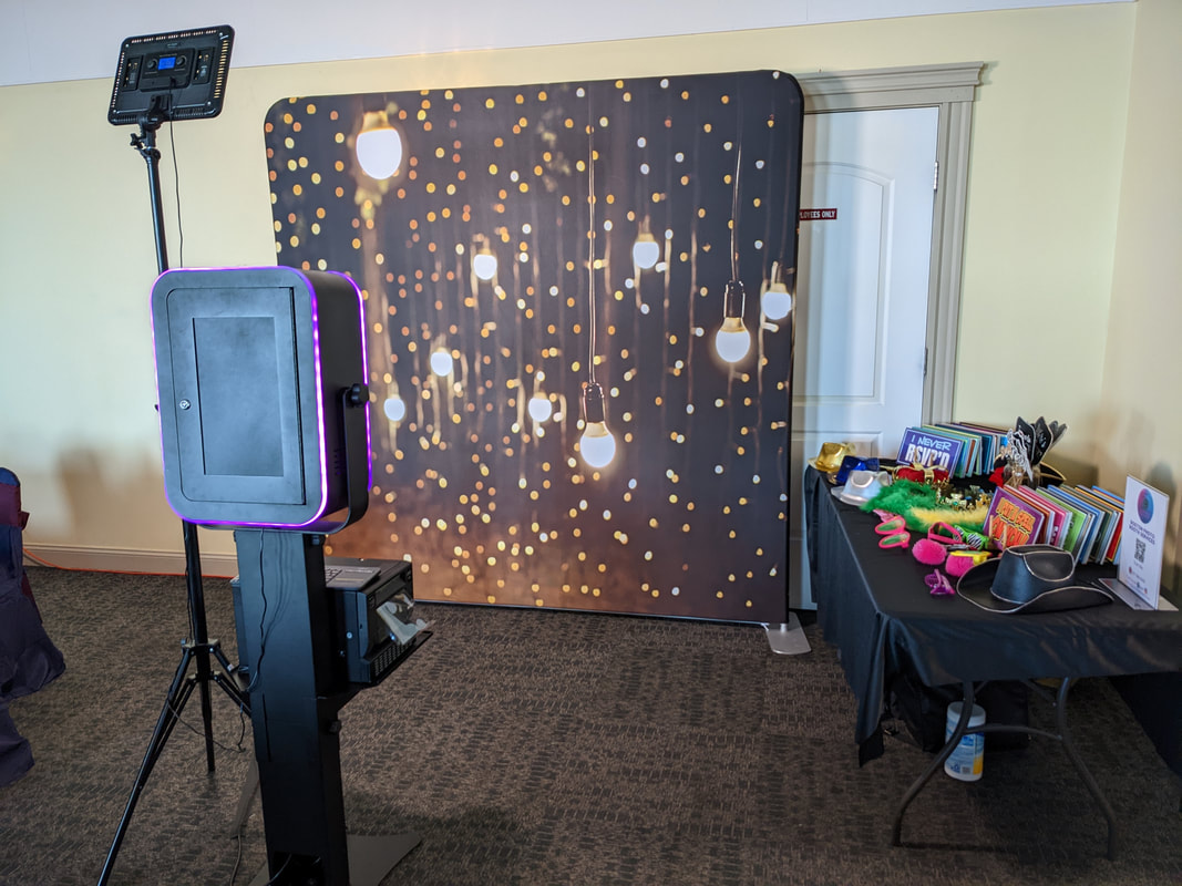 Photo Booth at graduation party with multiple props on a table